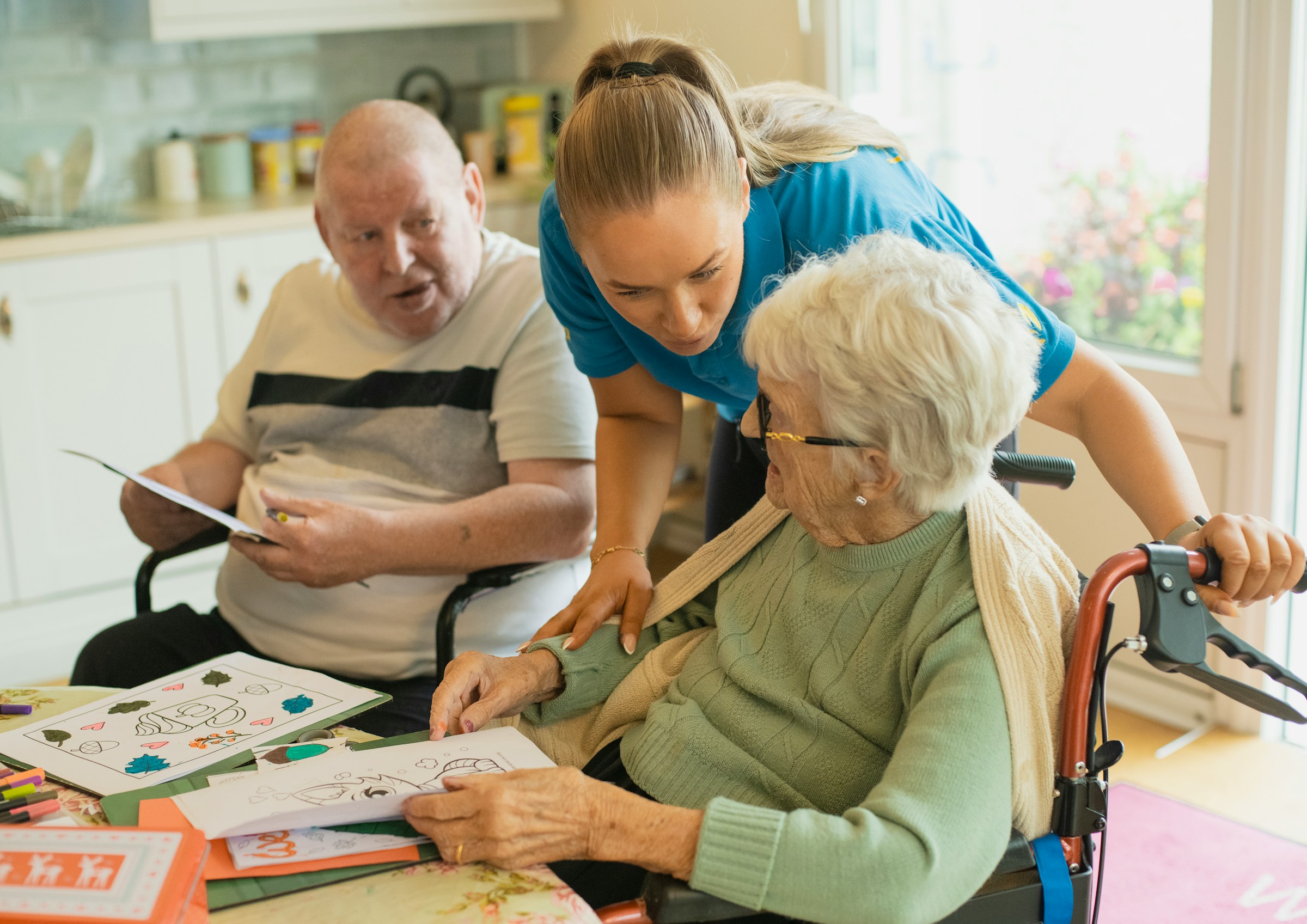 Nurse caring for elderly patient at home